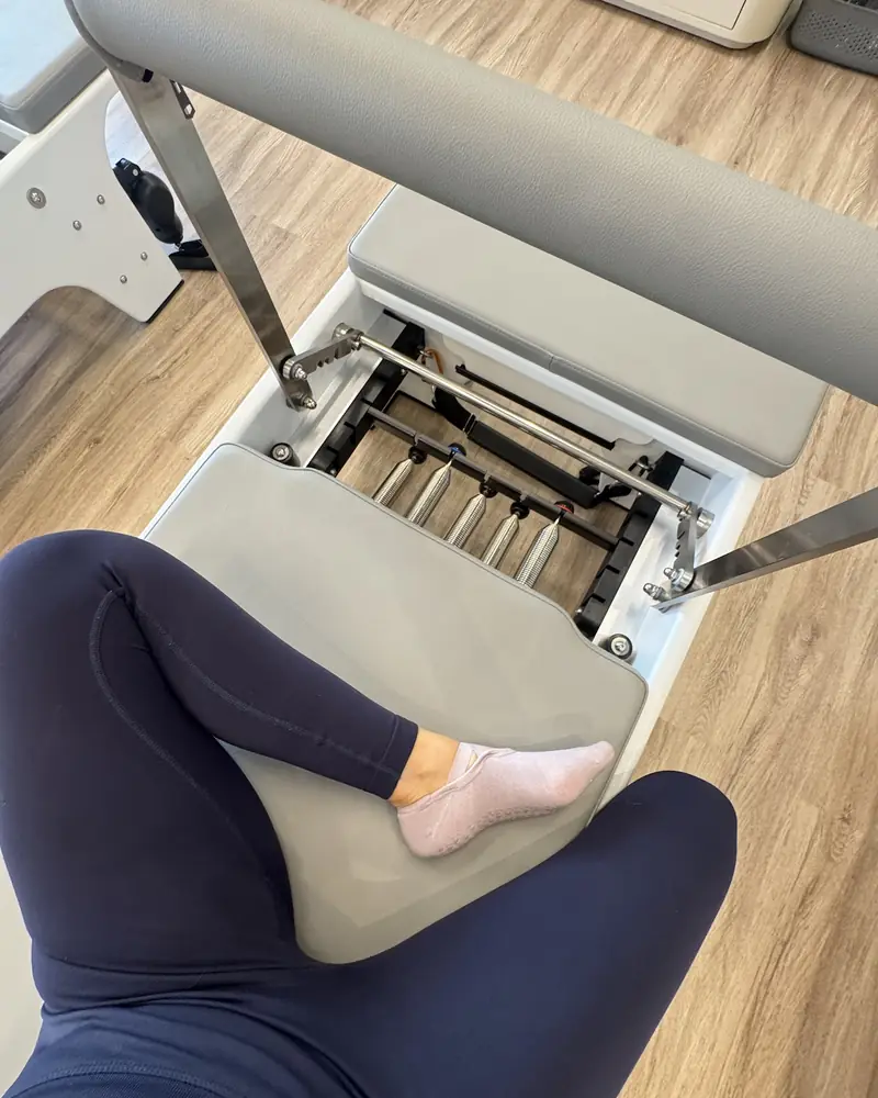 Close-up of a Reformer carriage and springs at Pilates Academy Arjan